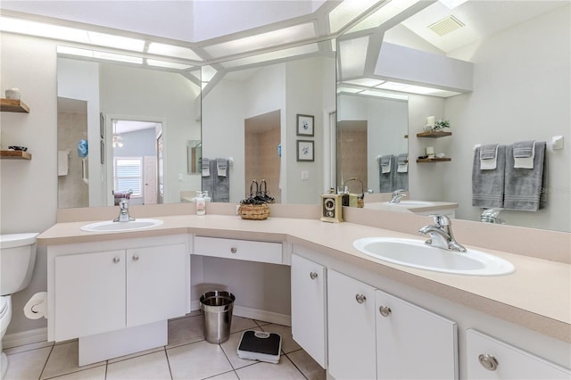 bathroom with tile patterned flooring, vanity, toilet, and lofted ceiling