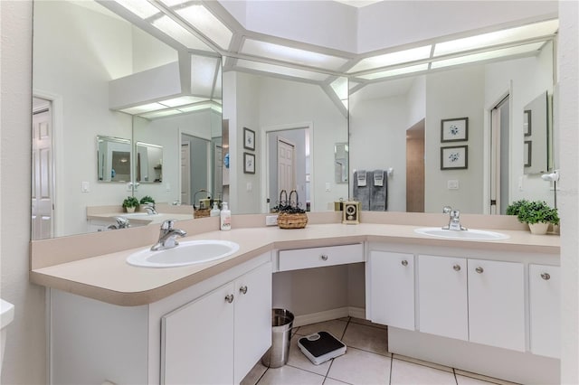 bathroom with vanity and tile patterned floors