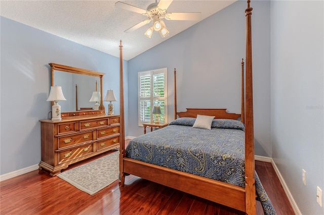 bedroom featuring hardwood / wood-style flooring, ceiling fan, a textured ceiling, and vaulted ceiling