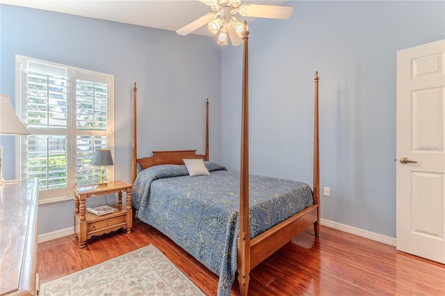 bedroom featuring hardwood / wood-style floors and ceiling fan