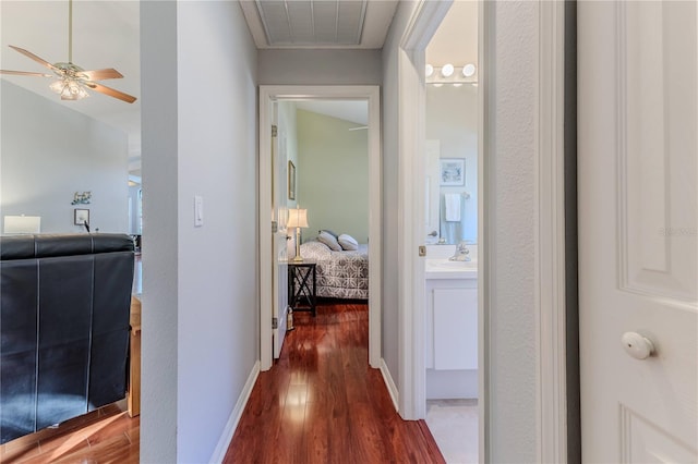 hall with dark hardwood / wood-style flooring