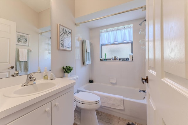 full bathroom featuring toilet, vanity, tile patterned floors, and shower / washtub combination