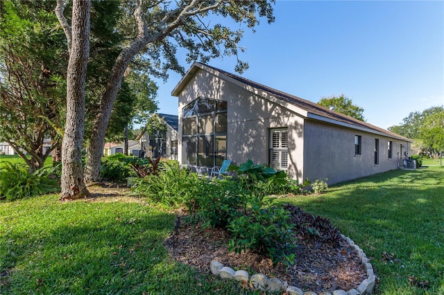 view of home's exterior featuring a lawn