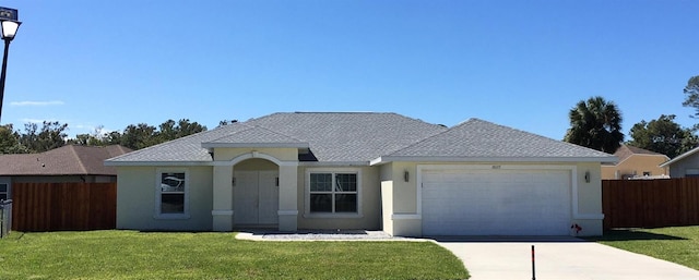 ranch-style home featuring a front yard and a garage