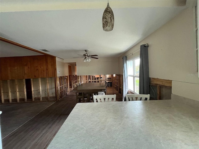 dining area with wood finished floors and ceiling fan