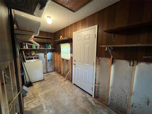 laundry area with washer / clothes dryer and wood walls