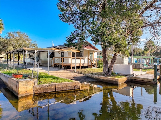 dock with a water view and fence