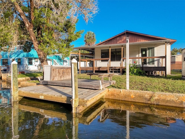 dock area featuring a water view