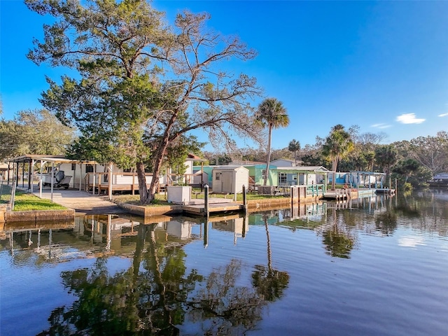 dock with a water view and a residential view