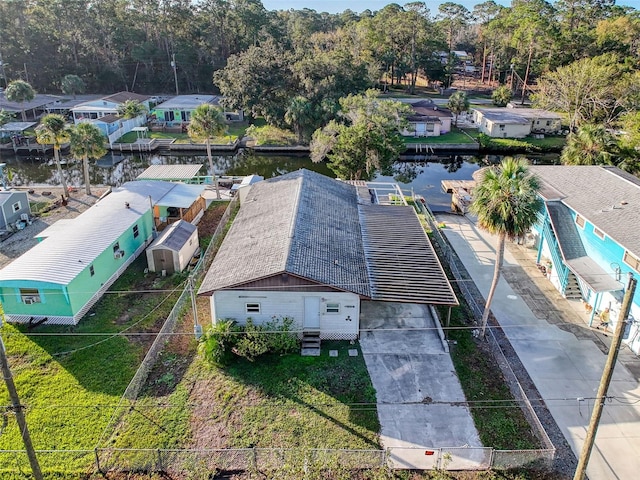 aerial perspective of suburban area featuring a nearby body of water