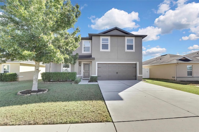 view of front of home featuring a front yard and a garage