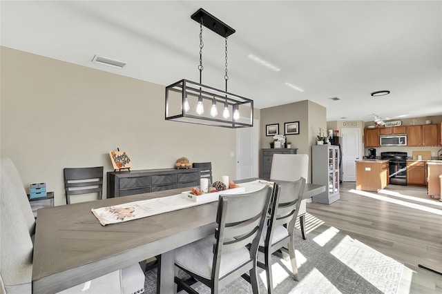 dining room featuring light hardwood / wood-style floors