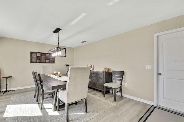 dining area featuring light wood-type flooring