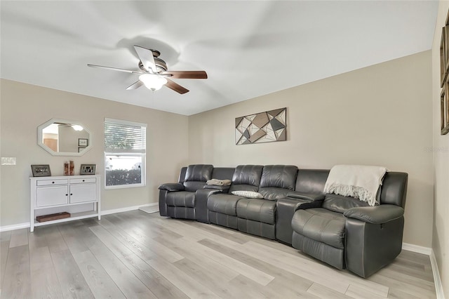 living room with ceiling fan and light hardwood / wood-style floors