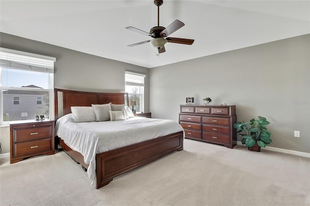 bedroom with ceiling fan and light colored carpet