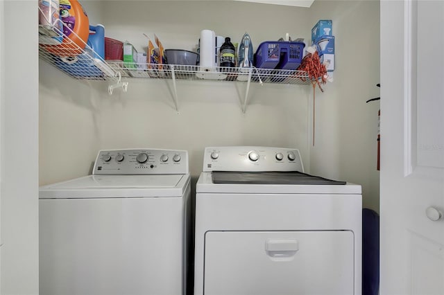 laundry room with washer and clothes dryer