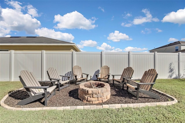 view of yard with a fire pit