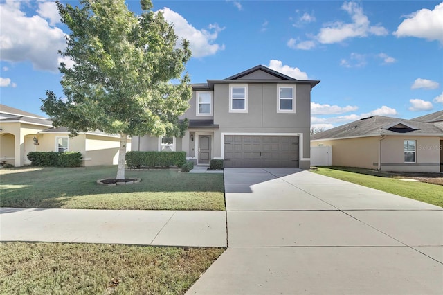 view of front of property featuring a garage and a front lawn