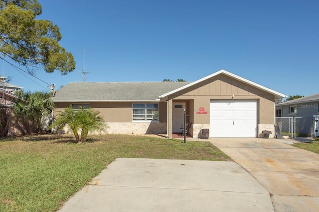 ranch-style house with a front lawn and a garage