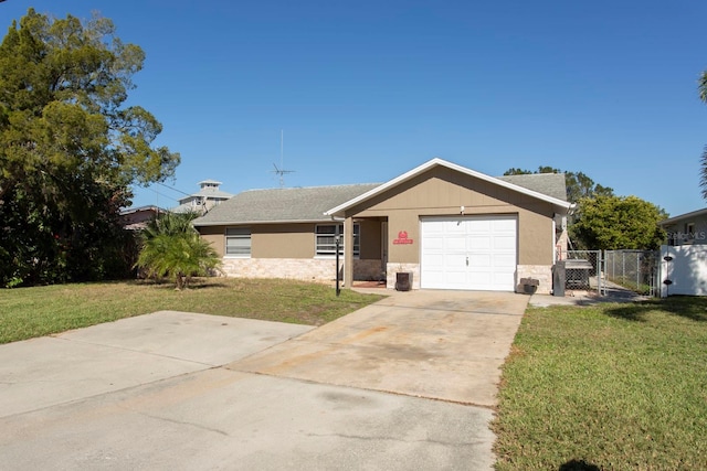 view of front of house with a front lawn and a garage