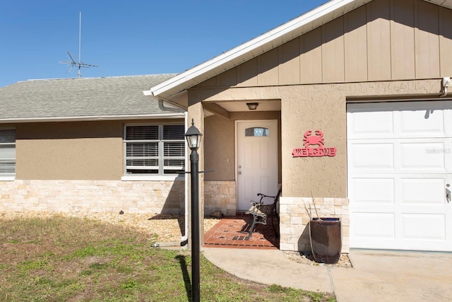 doorway to property featuring a garage