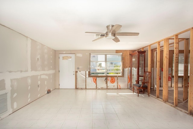 interior space featuring ceiling fan