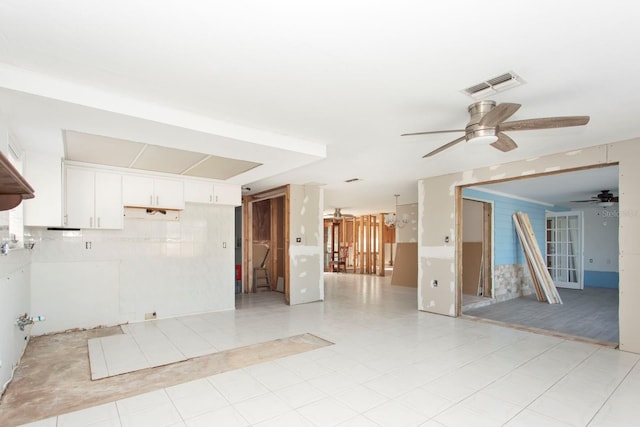 spare room featuring ceiling fan and light tile patterned floors