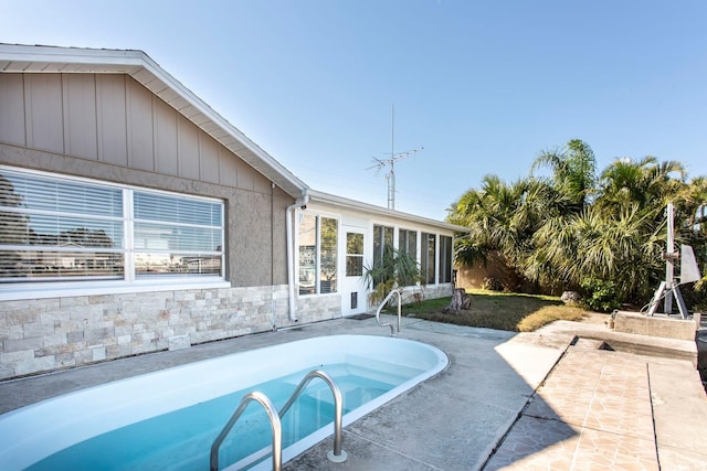 view of pool featuring a patio area