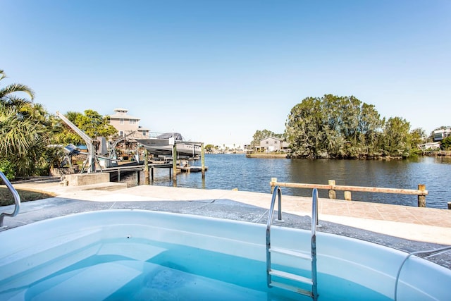 view of pool featuring a water view and a boat dock