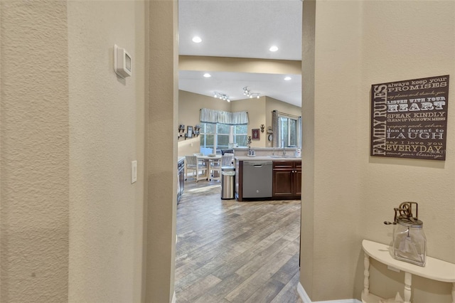 corridor with light hardwood / wood-style floors