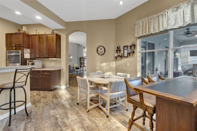 dining area featuring ceiling fan and light wood-type flooring