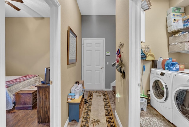 laundry area featuring washing machine and dryer, ceiling fan, and dark hardwood / wood-style floors