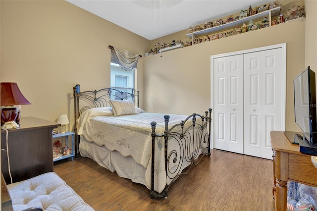 bedroom with hardwood / wood-style flooring and a closet