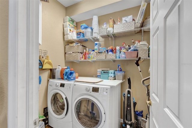 laundry area with washing machine and clothes dryer