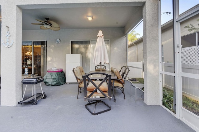 exterior space featuring ceiling fan