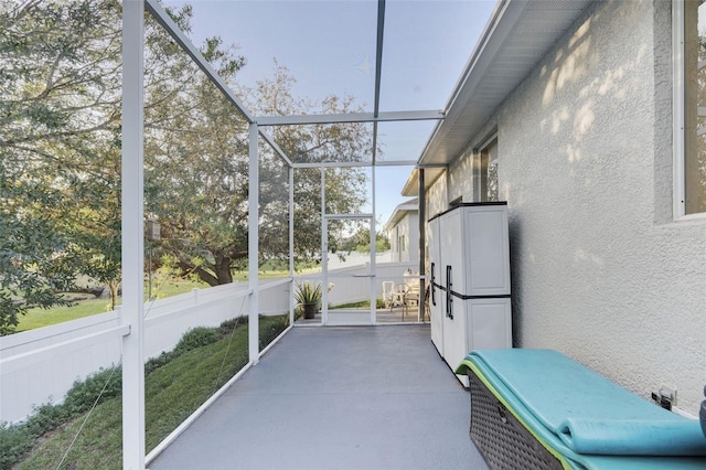 unfurnished sunroom featuring a wealth of natural light