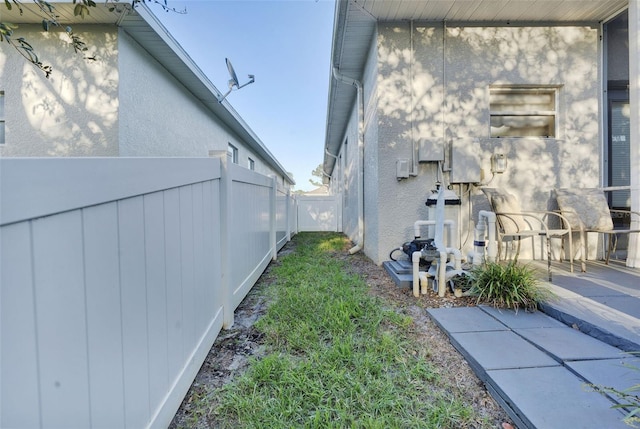 view of property exterior with a patio