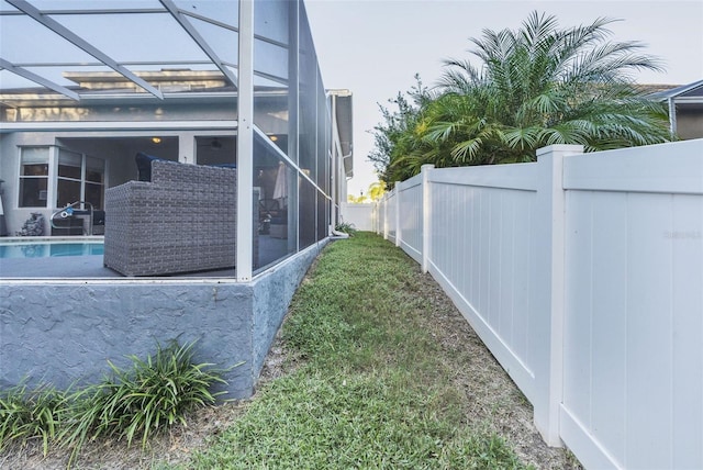 view of yard with a lanai