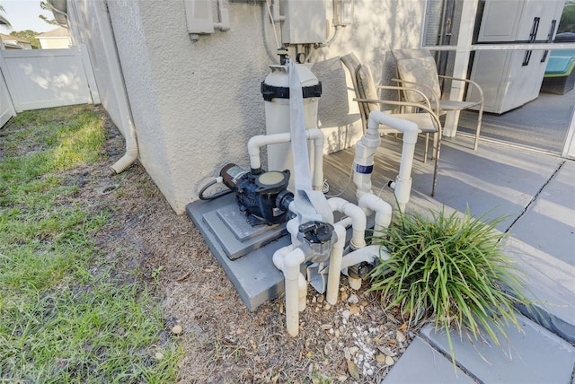 2533 Wood Pointe Dr, Holiday, FL 34691 - exterior view of fence and stucco siding