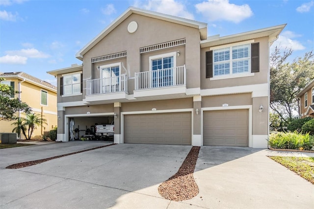 view of front facade featuring a garage and a balcony