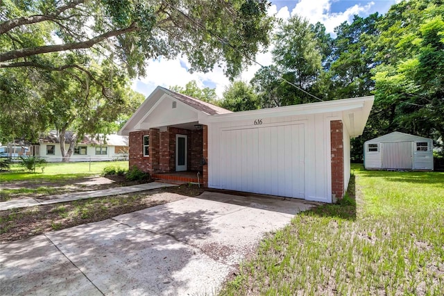 ranch-style house with a front yard and a storage unit