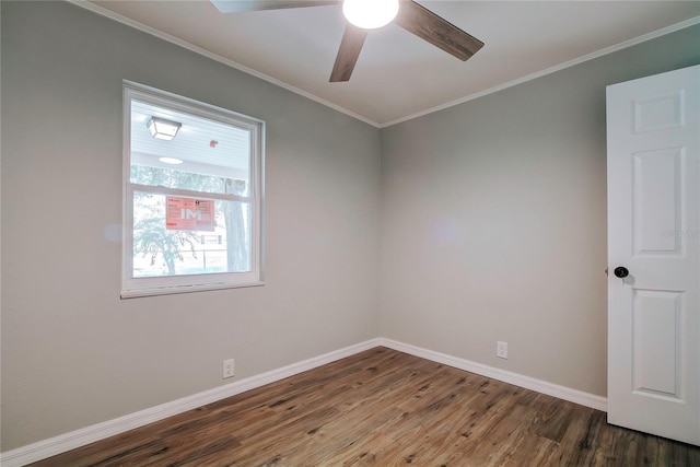 empty room with ceiling fan, wood-type flooring, and crown molding