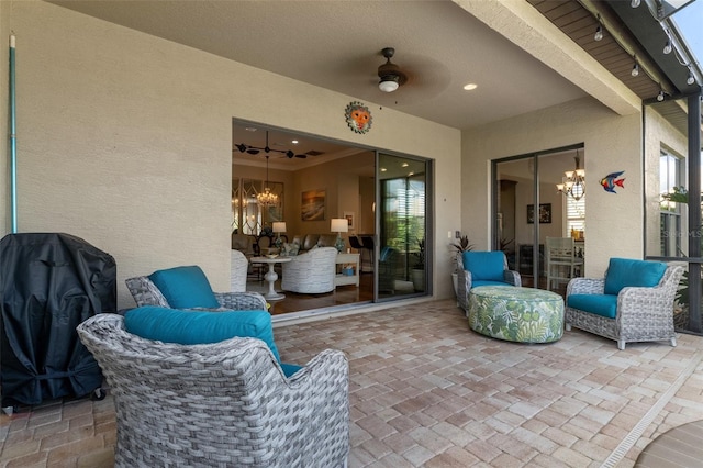 view of patio featuring ceiling fan