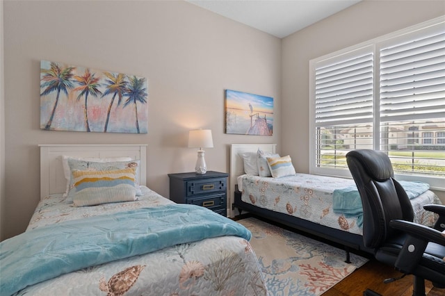 bedroom with wood-type flooring