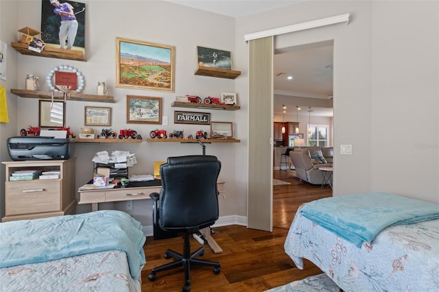 bedroom with dark hardwood / wood-style flooring