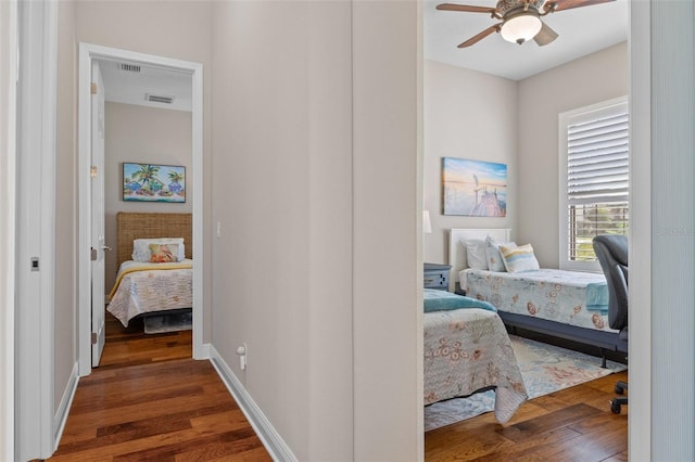 bedroom featuring ceiling fan and dark hardwood / wood-style floors