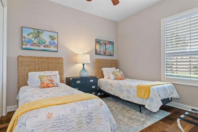 bedroom with ceiling fan and dark hardwood / wood-style floors