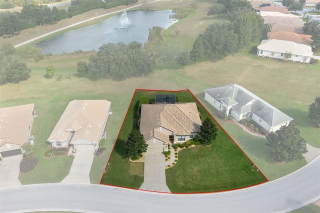 birds eye view of property with a water view