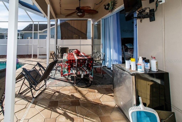 view of patio / terrace featuring ceiling fan, a lanai, and a fenced in pool