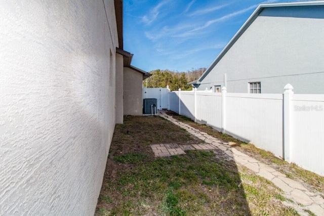 view of yard with central air condition unit